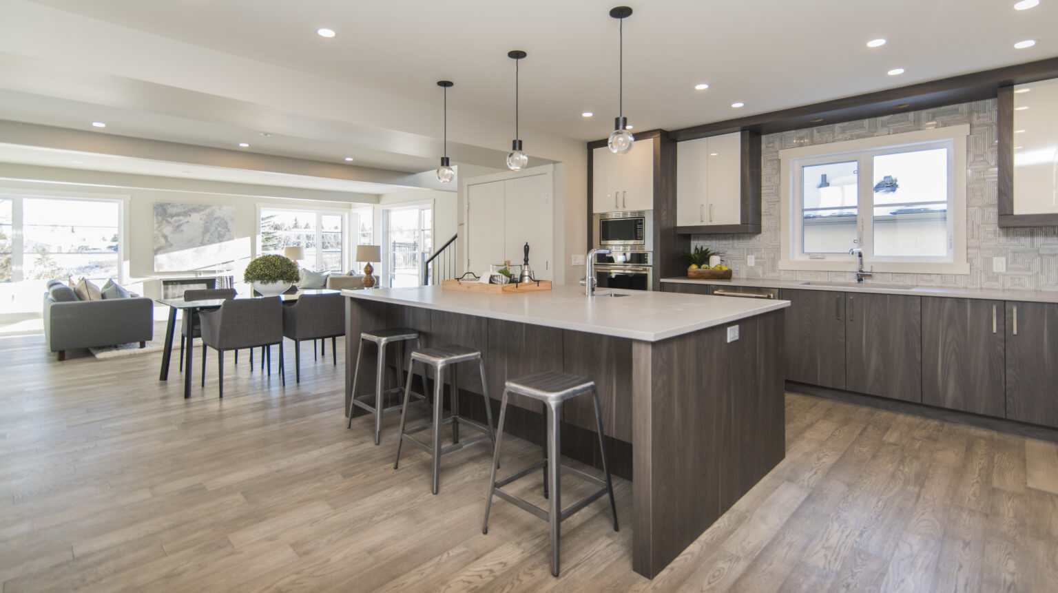 A beautiful shot of a modern house kitchen and dining room